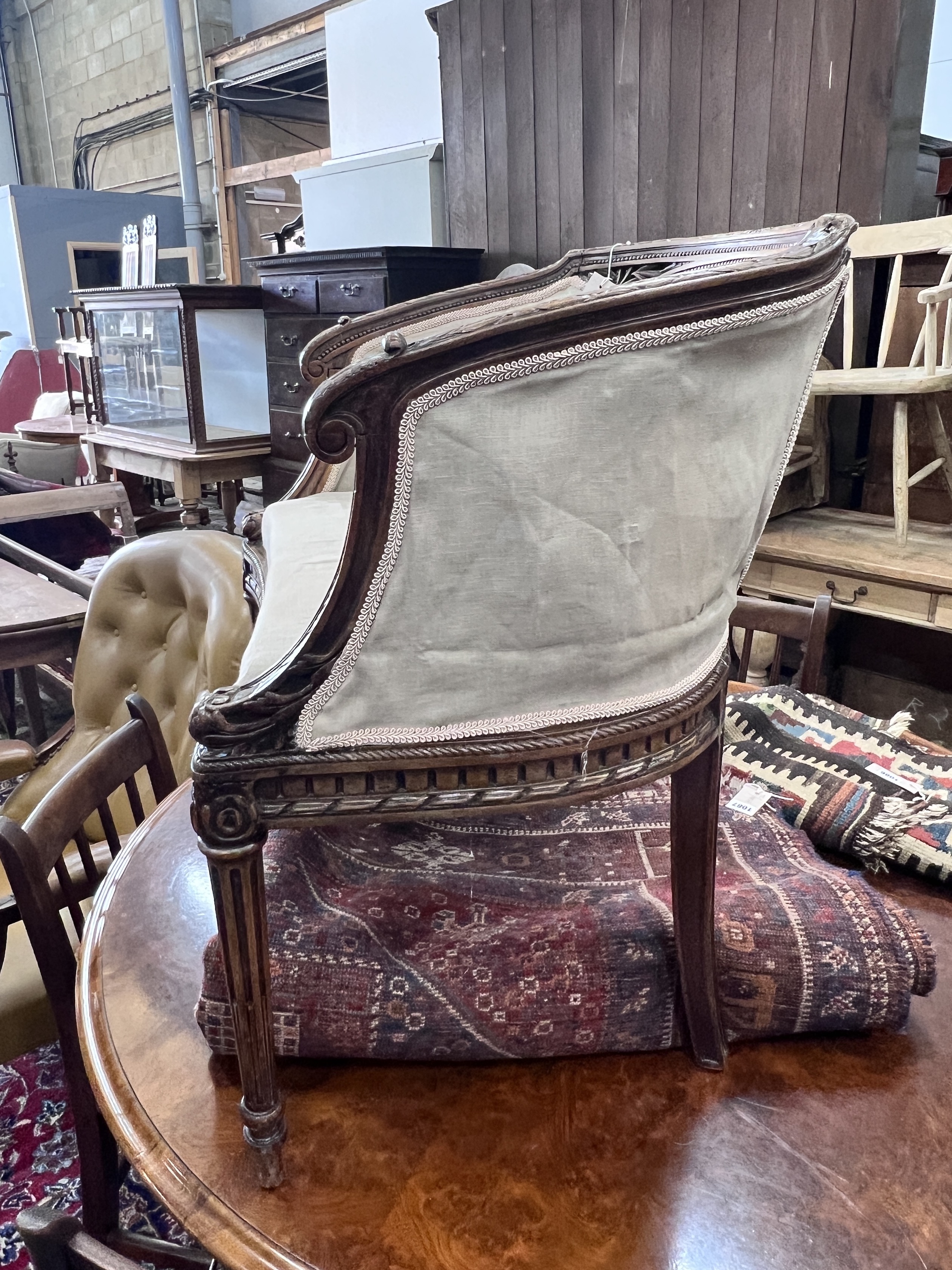 A Louis XVI style caned beech tub framed side chair